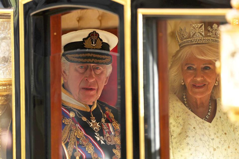 <p>Daniel Leal/WPA Pool/Getty</p> King Charles and Queen Camilla  arrive in the Diamond Jubilee State Coach for the State Opening of Parliament in the House of Lords on November 7, 2023.