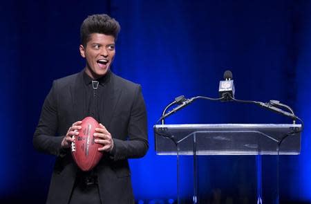 Singer Bruno Mars speaks at the Super Bowl half time press conference in New York, January 30, 2014. REUTERS/Carlo Allegri