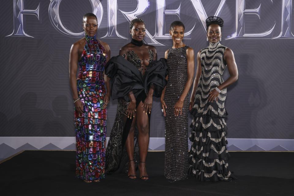 Florence Kasumba, from left, Danai Gurira, Letitia Wright and Lupita Nyong'o pose for photographers upon arrival for the premiere of the film 'Black Panther: Wakanda Forever' in London, Thursday, Nov. 3, 2022. (Photo by Vianney Le Caer/Invision/AP)