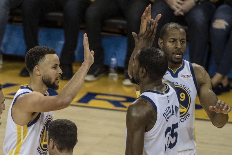 Veteran guard/forward Andre Iguodala (R) teamed up with guard Stephen Curry (L) and forward Kevin Durant to win championships with the Golden State Warriors in 2017 and 2018. File Photo by Terry Schmitt/UPI