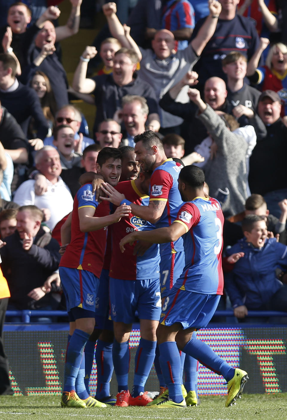 Crystal Palace's players celebrate Chelsea's own goal, during their English Premier League soccer match at Selhurst Park, London, Saturday, March 29, 2014. (AP Photo/Sang Tan)