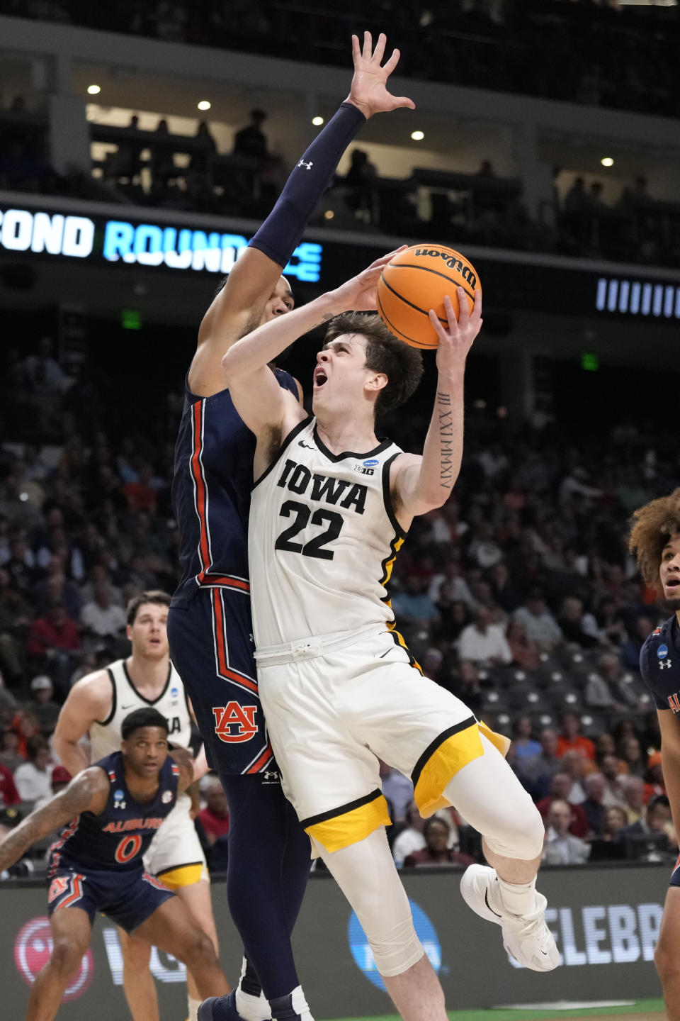 Iowa forward Patrick McCaffery (22) shoots against Auburn during the first half of a first-round college basketball game in the men's NCAA Tournament in Birmingham, Ala., Thursday, March 16, 2023. (AP Photo/Rogelio V. Solis)