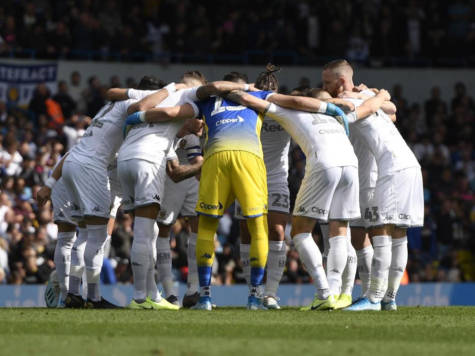 The Leeds United team in a huddle: Getty Images