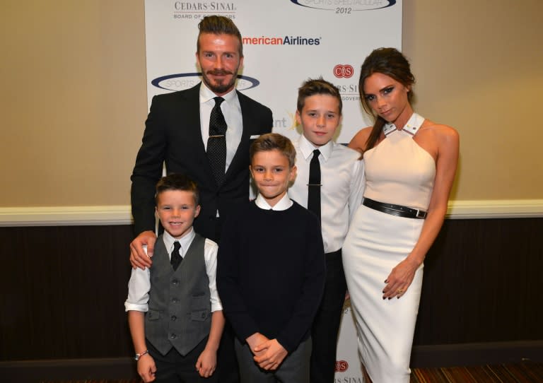 Victoria Beckham, shown here with footballer husband David and three of their children, says the secret of her success is a tireless work ethic and the support of her family