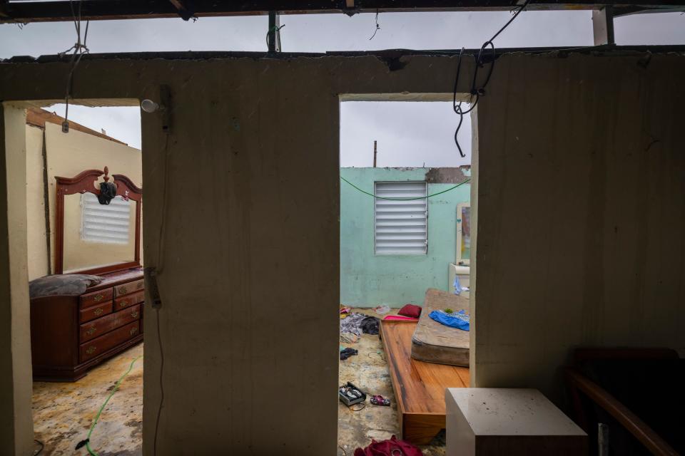 Nelson Cirino's home stands with its roof torn off by the winds of Hurricane Fiona in Loiza, Puerto Rico, on Sept. 18, 2022.