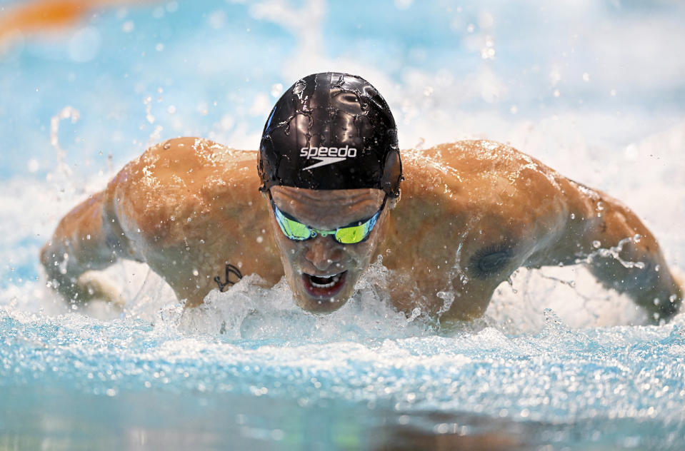 Cody Simpson competes during the men's 100m butterfly heats at the Australian swimming championships in Adelaide, Wednesday, May 18, 2022. Taking time out from his singing career to focus on swimming has started to pay off for Simpson, who was selected in the Commonwealth Games swim team after placing third in the 100-meter butterfly event at the Australian trials. (Dave Hunt/AAP Image via AP)