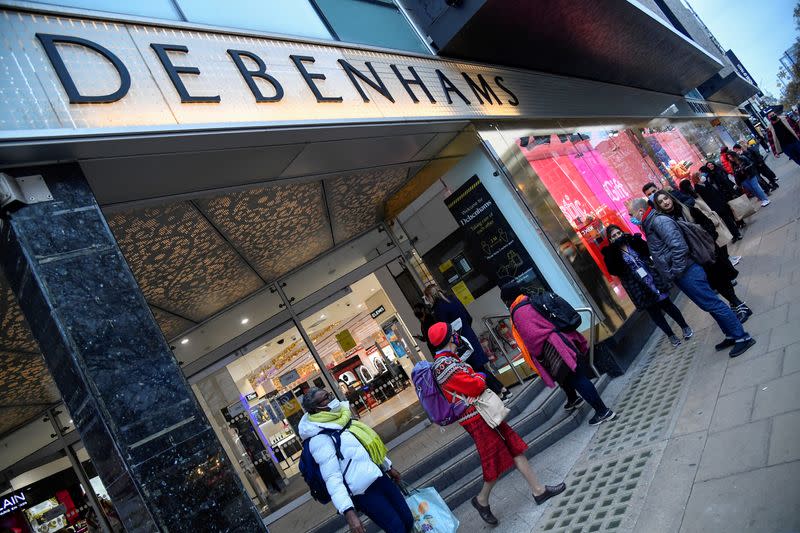 FILE PHOTO: Shoppers queue to enter a Debenhams store in Oxford Street in London after the end of second coronavirus lockdown in England