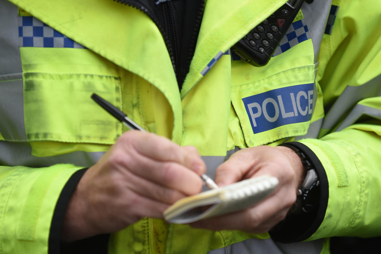 EMBARGOED TO 0001 THURSDAY AUGUST 11 File photo dated 22/10/14 of a police officer writing on paper, as most victims of burglary, robbery and theft 