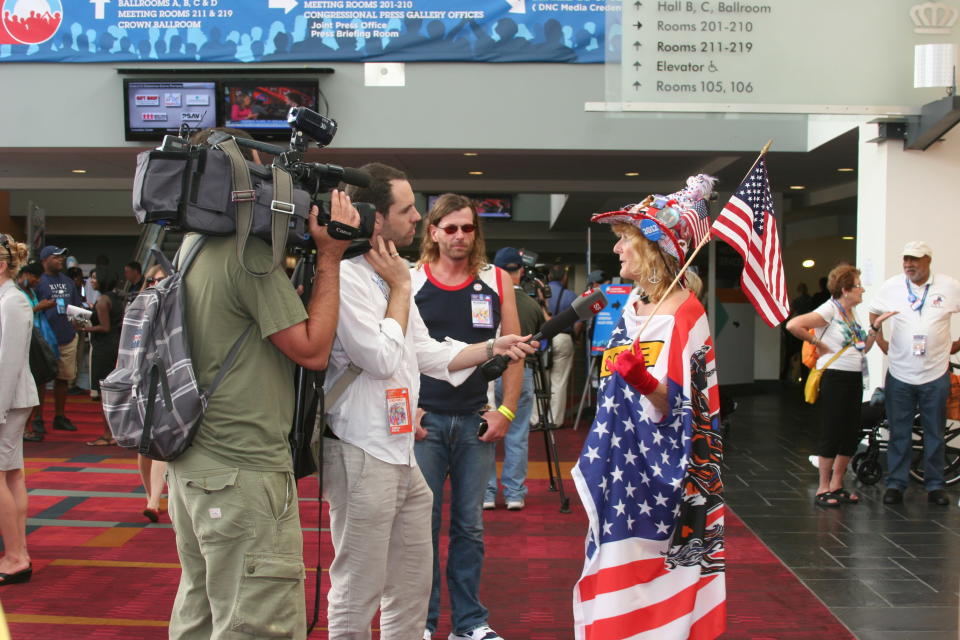 A festively dressed woman is interviewed at the media filing center for the Democratic National Convention on Tuesday Sept. 4, 2012. (Torrey AndersonSchoepe/Yahoo! News)