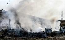 Smoke rises from damaged police headquarters after a suicide truck bombing killed eleven Turkish police officers and injured 78 people on August 26, 2016 in Cizre, southeastern Turkey, in an attack that was blamed on Kurdish militants by state media