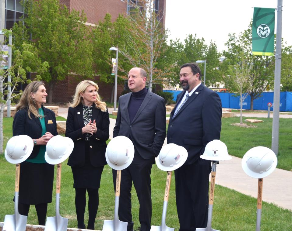 Sue VanderWoude, dean of the College of Veterinary Medicine and Biomedical Sciences, left, Colorado State University President Amy Parsons, Colorado Gov. Jared Polis and CSU System Chancellor Tony Frank chat during a groundbreaking ceremony Thursday for a new $230 million Veterinary Health and Education Complex at CSU's South Campus in Fort Collins, Colo.