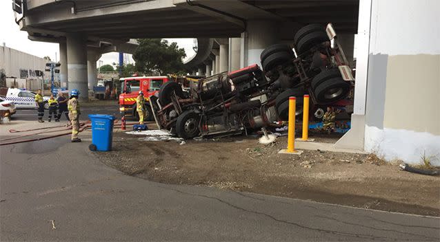 The truck fell 10 metres off a bridge. Source: Facebook / MFB / Commander Rick Gili