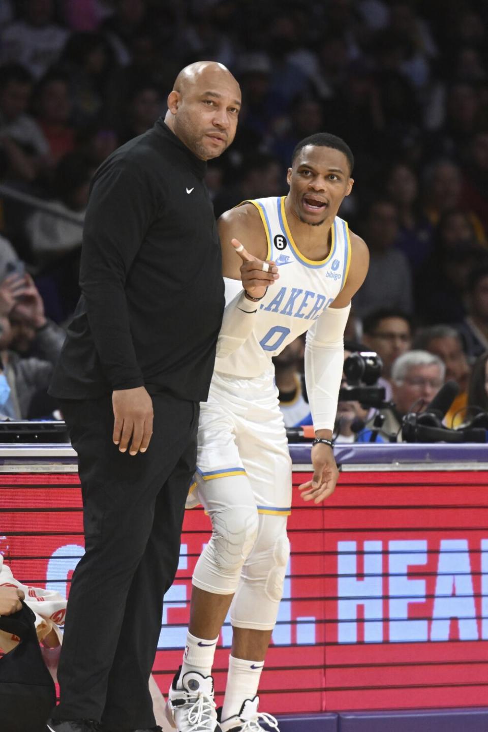 Darvin Ham stands with guard Russell Westbrook