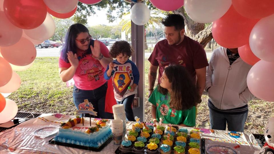 Maria "Cami" Lopez (left) and her family celebrate the third birthday of her son, Santhiago (center), along with her daughter, Isabella, 10, (seated), and the children's father, Felipe Vargas, in early November at GT Bray Park in Bradenton.