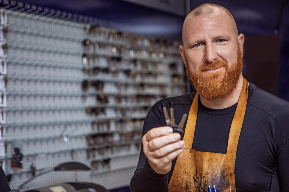 A locksmith holding keys