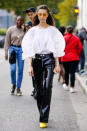 <p>Vinyl trousers have a reputation for being difficult to pull off, but they don't have to be. Opt for a flared or straight-leg style rather than something skinny and then team with a feminine piece, like this floaty blouse.</p>