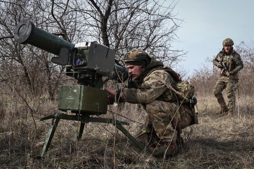 Ukrainian soldiers install an anti-tank missile system 'Stugna' near Bakhmut, Donetsk region, Ukraine, Friday, March 17, 2023.