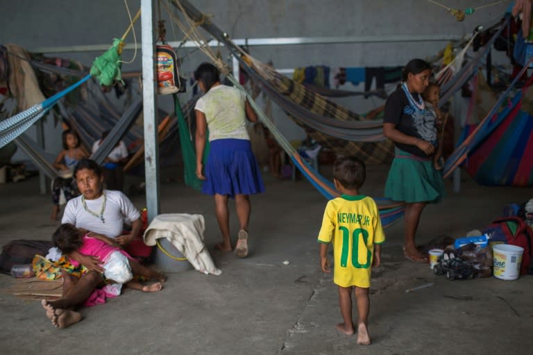 Venezuelan refugees rest inside a temporary shelter in the city of Pacaraima in Brazil