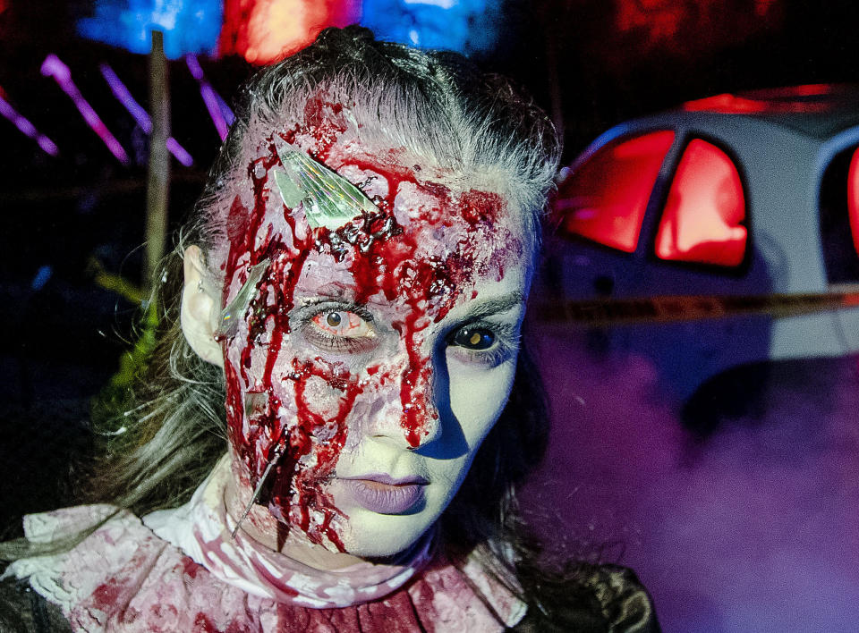 An actress poses in the medieval Frankenstein Castle about 35 kilometers (22 miles) south of Frankfurt, Germany Saturday, Oct. 26, 2019. For 42 years the castle stages spooky Halloween events with monsters and live shows on three weekends around Halloween. (AP Photo/Michael Probst)
