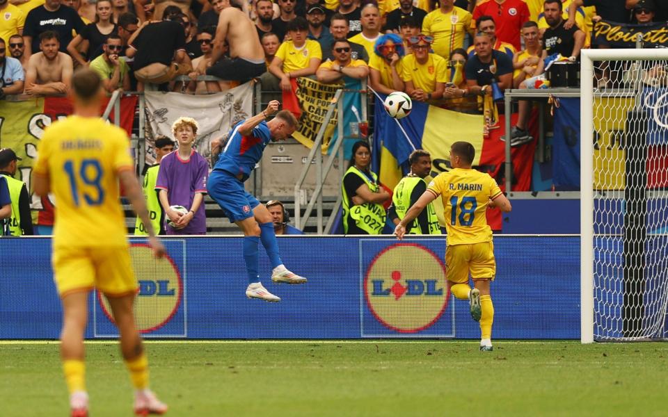 Ondrej Duda forces a superb header past Florin Nita to give Slovakia the lead.