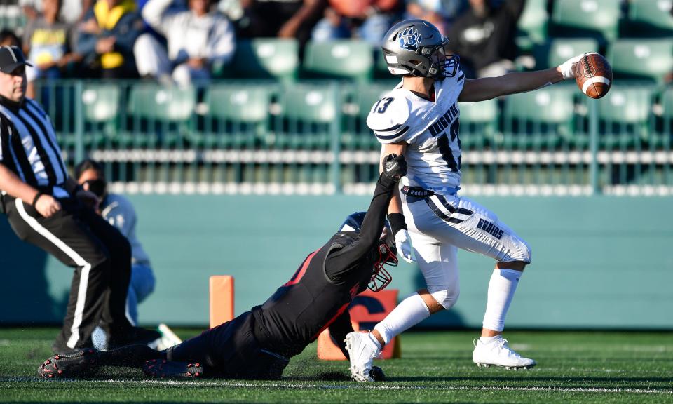 Brighton's Gavin Parks, right, scores a touchdown past Wilson's Jahmez Larkins during a regular season game at Rochester Community Sports Complex, Thursday, Aug. 31, 2023.