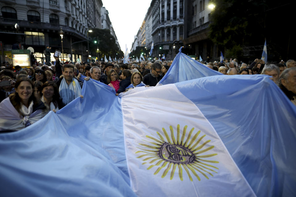 Supporters of Argentina President Mauricio Macri march to Plaza de Mayo in Buenos Aires, Argentina, Saturday, Aug. 24, 2019. Following a social media campaign large numbers of people gathered in the center of Buenos Aires to show their support for Macri's administration. (AP Photo/Natacha Pisarenko)