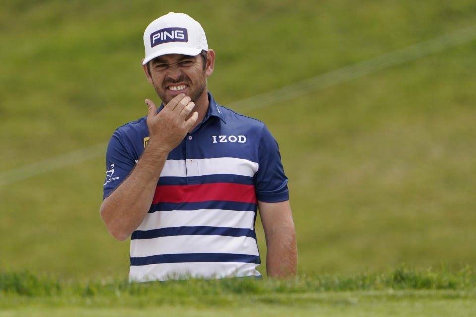 Louis Oosthuizen, of South Africa, reacts after his shot from a bunker on the 11th hole during the second round of the U.S. Open Golf Championship, Friday, June 18, 2021, at Torrey Pines Golf Course in San Diego. (AP Photo/Jae C. Hong)