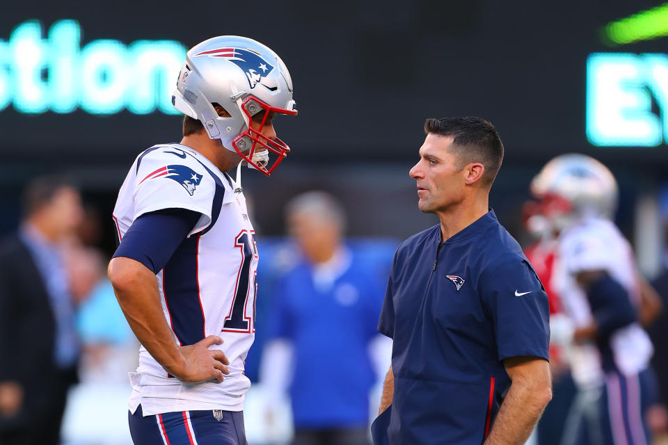 EAST RUTHERFORD, NJ - AUGUST 30:  New England Patriots quarterback Tom Brady (12) talks with New England Patriots Director of PLayer Personnel Nick Caserio prior to the National Football League game between the New York Giants and the New England Patriots on August 30, 2018 at MetLife Stadium in East Rutherford, NJ.  (Photo by Rich Graessle/Icon Sportswire via Getty Images)