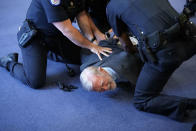 <p>Members of U.S. Capitol Police arrest protester and former CIA officer Ray McGovern during a confirmation hearing for CIA Director nominee Gina Haspel before the Senate (Select) Committee on Intelligence May 9, 2018 in Washington, DC. If confirmed, Haspel will succeed Mike Pompeo to be the next CIA director. (Photo from Alex Wong/Getty Images) </p>