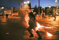 Riot police run as they disperse protesters during clashes in Athens, Greece in this July 15, 2015 file photo. REUTERS/Yannis Behrakis/Files