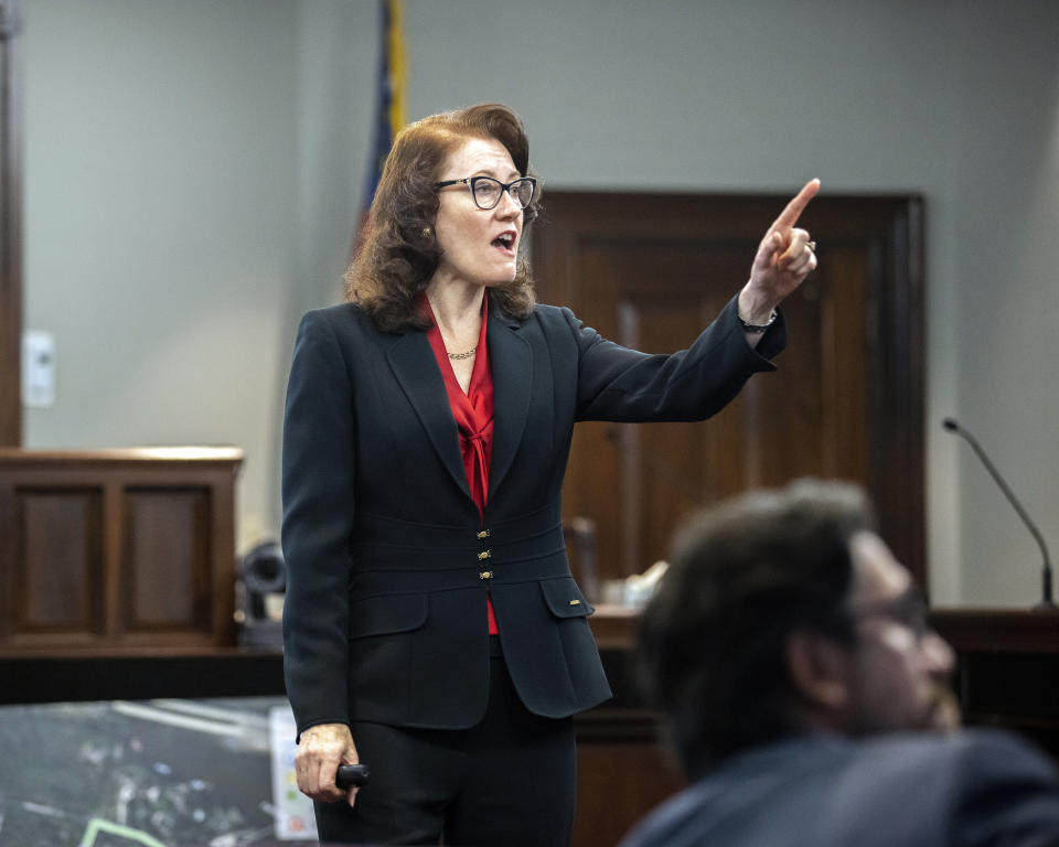 Prosecutor Linda Dunikoski presents a closing argument to the jury during the trial of Travis McMichael, his father, Gregory McMichael, and William "Roddie" Bryan, at the Glynn County Courthouse, Monday, Nov. 22, 2021, in Brunswick, Ga. The three men charged with the February 2020 slaying of 25-year-old Ahmaud Arbery. (AP Photo/Stephen B. Morton, Pool)