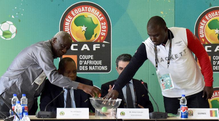 (L-R) President of the Malian football federation Baba Diarra, CAF's president Issa Hayatou, CAF's secretary general Icham El Amrani and financial director of Guinea's sports ministry Amara Dabo take part in a draw in Malabo on January 29, 2015