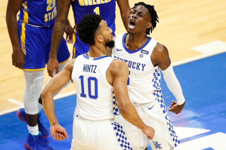 Kentucky’s Terrence Clarke (5) celebrates with teammate Davion Mintz (10) during last year’s season opener against Morehead State.
