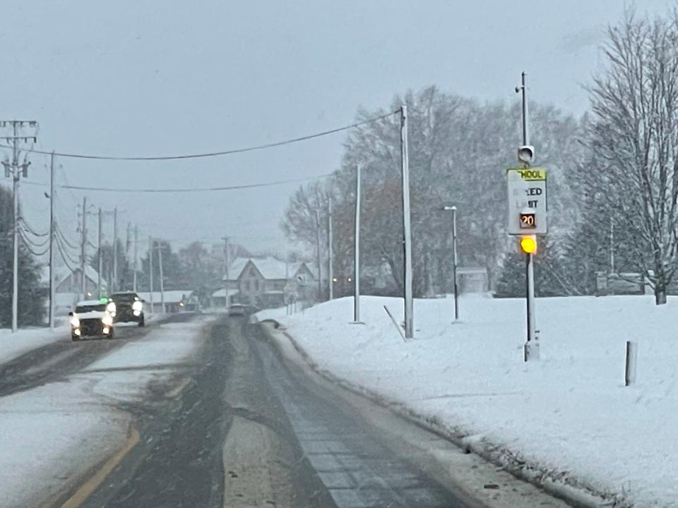 Wooster City Schools and many area districts cancel classes on Wednesday after an overnight snowstorm made roadways treacherous. The 20 mph flashers caution drivers to slow down outside of Wooster Township Elementary.