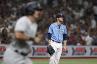 Tampa Bay Rays pitcher Jeffrey Springs waits after giving up a home run to New York Yankees' Matt Carpenter, foreground, during the fourth inning of a baseball game Friday, May 27, 2022, in St. Petersburg, Fla. (AP Photo/Scott Audette)