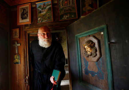 Hermit Stan Vanuytrecht of Belgium walks into the chapel of the hermitage in Saalfelden, Austria, May 22, 2017. Picture taken May 22, 2017. REUTERS/Leonhard Foeger