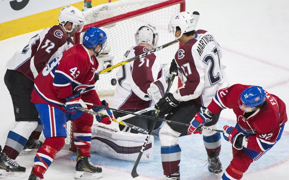 Montreal Canadiens' Brian Flynn (32) scores against Colorado Avalanche goaltender Calvin Pickard during the first period of an NHL hockey game in Montreal, Saturday, Dec. 10, 2016. (Graham Hughes/The Canadian Press via AP)