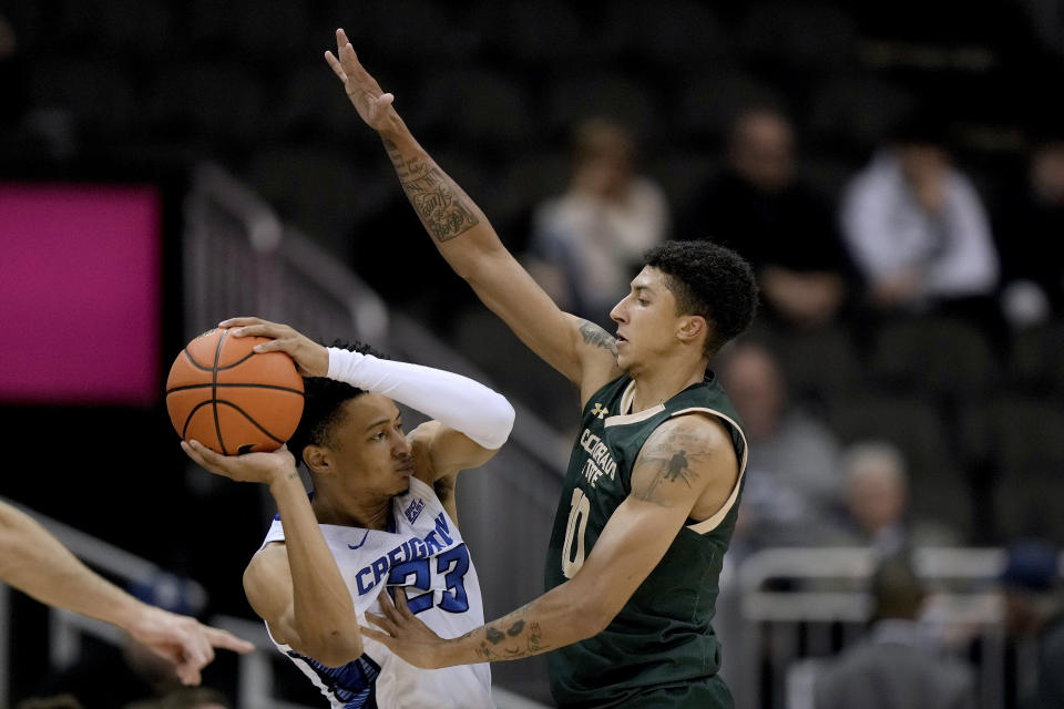 Creighton guard Trey Alexander (23) is pressured by Colorado State guard Nique Clifford (10) during the second half of an NCAA college basketball game Thursday, Nov. 23, 2023, in Kansas City, Mo. Colorado State won 69-48. (AP Photo/Charlie Riedel)