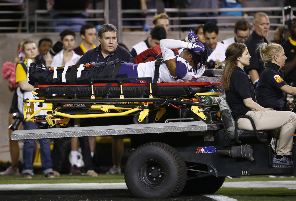 Washington defensive back Jordan Miller (23) is carted off the field due to injury during the second half of an NCAA college football game against Arizona State Saturday, Oct. 14, 2017, in Tempe, Ariz. Arizona State defeated Washington 13-7. (AP Photo/Ross D. Franklin)