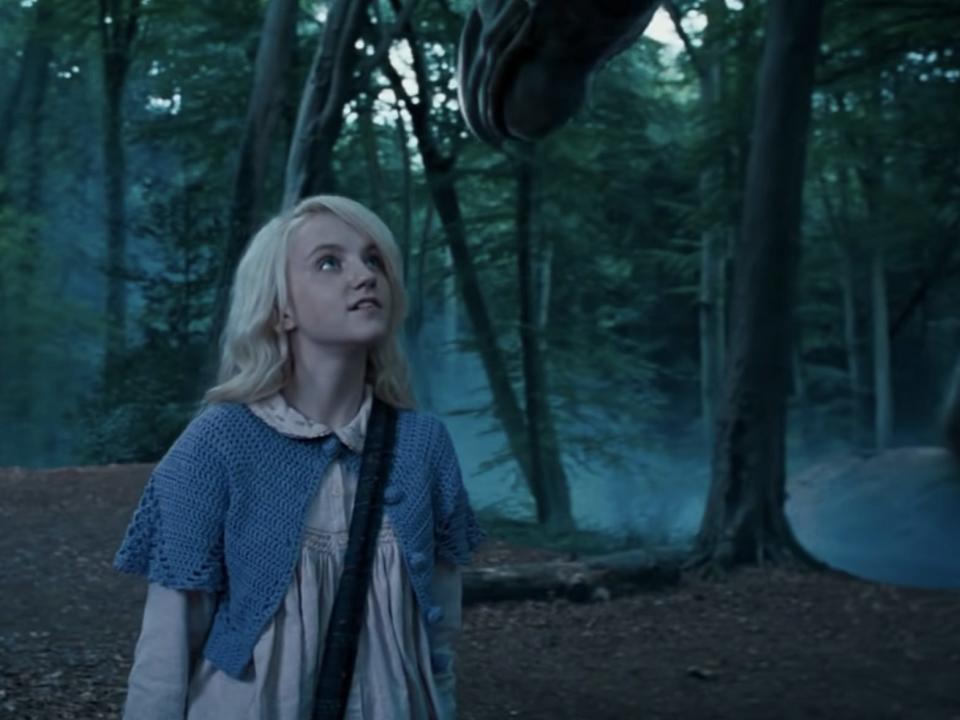 harry and luna standing next to a thestral in order of the phoenix