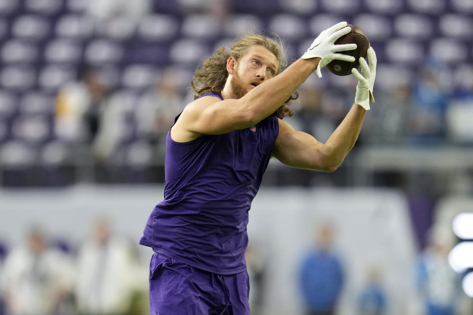 Minnesota Vikings tight end T.J. Hockenson warms up before an NFL football game against the Detroit Lions, Sunday, Dec. 24, 2023, in Minneapolis. (AP Photo/Abbie Parr)