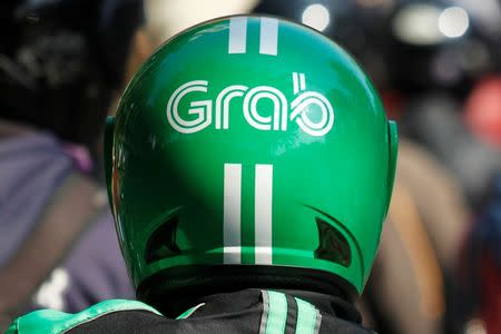 The helmet of a Grab bike rider is seen during rush hour traffic in Jakarta, Indonesia, July 18, 2016. REUTERS/Iqro Rinaldi