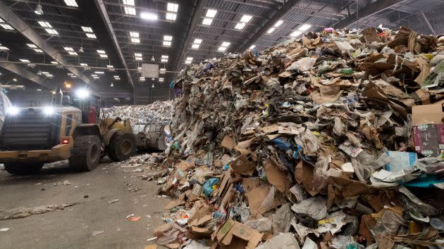 Heavy machinery moves material on the tip floor, where trucks dump their contents before waste is sorted at Republic Services in Anaheim, California, on April 15, 2021.  (Photo: MediaNews Group/Orange County Register via Getty Images via Getty Images)