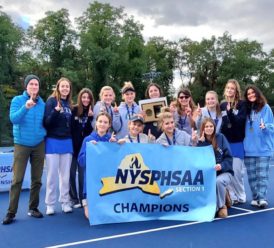 The Bronxville girls tennis team celebrates its Section 1 small-school championship win over defending section and state champion Byram Hills Oct. 15, 2023 at Harrison High School.