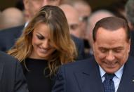 Silvio Berlusconi (R) will celebrate his 80th birthday with his girlfriend Francesca Pascale (L) and an extended family he admits to having neglected during the course of his business and political careers