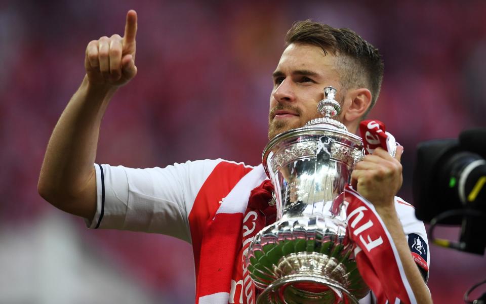 Winning goalscorer Aaron Ramsey gets his hands on the FA Cup  - Credit: Laurence Griffiths/Getty Images Europe