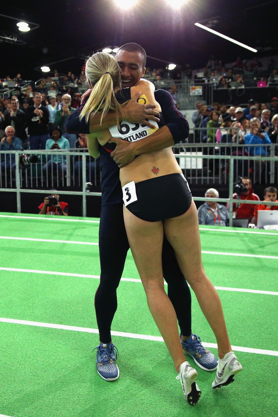 <p>Brianne Theisen Eaton of Canada is congratulated by her husband Ashton Eaton of the United States on winning the gold medal after the Women’s Pentathlon 800 Metres during day two of the IAAF World Indoor Championships at Oregon Convention Center on March 18, 2016 in Portland, Oregon. (Photo by Ian Walton/Getty Images for IAAF) </p>