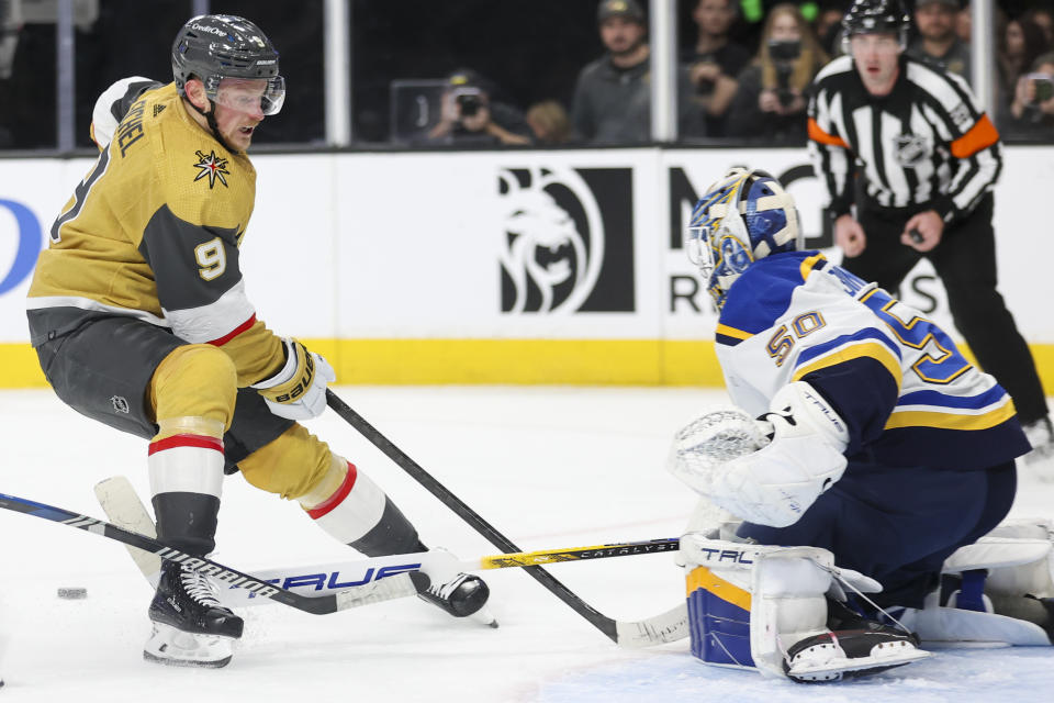 Vegas Golden Knights center Jack Eichel (9) attempts to score past St. Louis Blues goaltender Jordan Binnington (50) during the second period of an NHL hockey game Monday, Dec. 4, 2023, in Las Vegas. (AP Photo/Ian Maule)