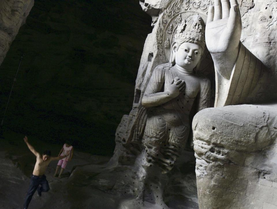 The Yungang Grottoes are a classical masterpiece of Chinese Buddhist art and were included in the UNESCO World Heritage list in 2001 (Getty Images)