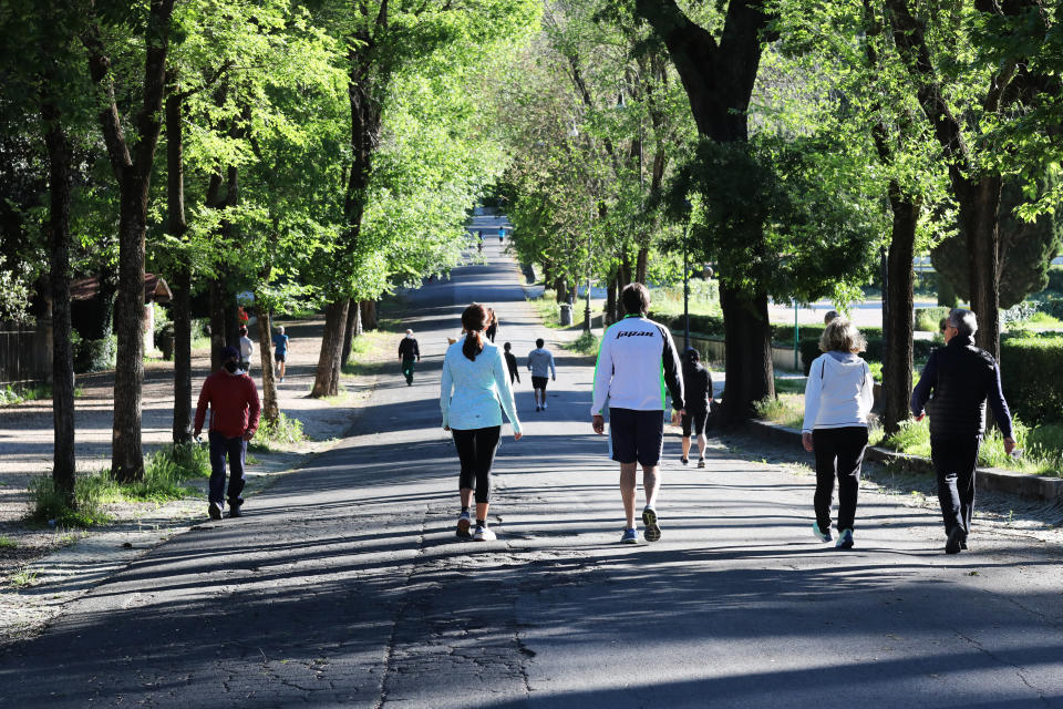 People enjoy the Villa Borghese park in Rome, Italy, on Monday.